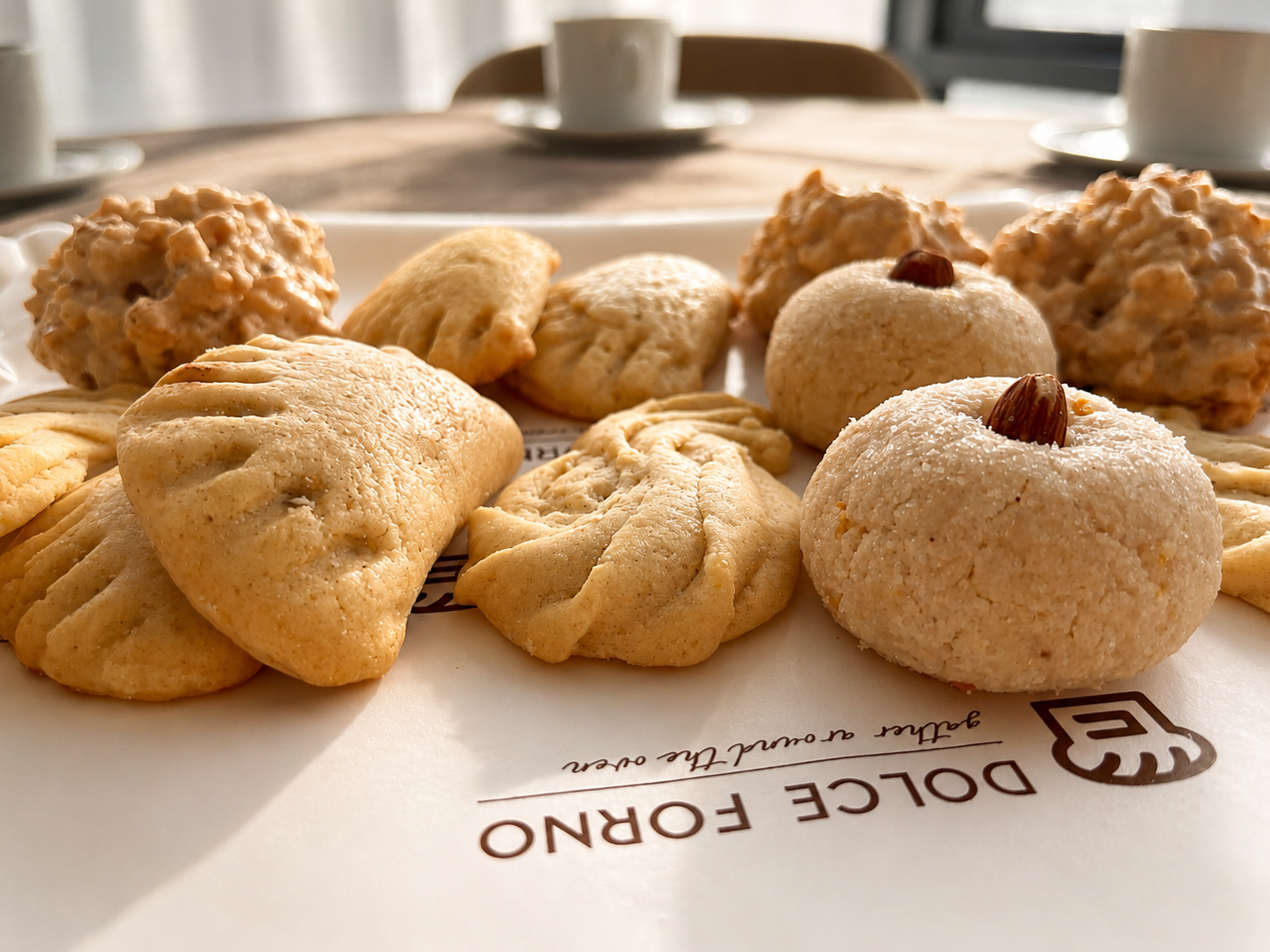 Family sharing coffee and Italian biscuits around the table
